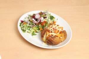 Jacket potato, chicken tikka and cheese with salad